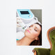 Woman getting laser face treatment in medical spa center 