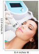 Woman getting laser face treatment in medical spa center 