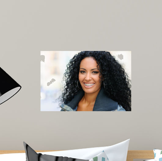 Young black woman smiling with braces 