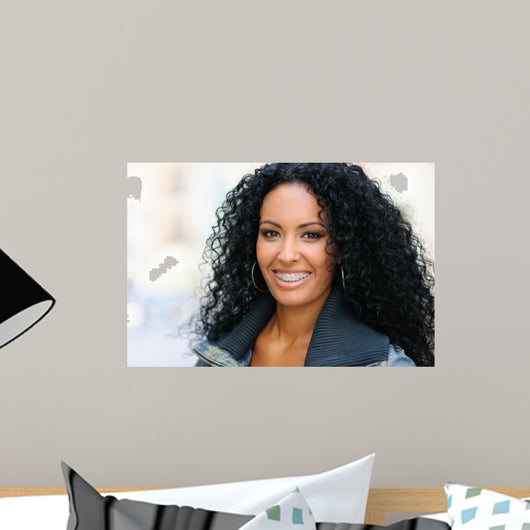 Young black woman smiling with braces 