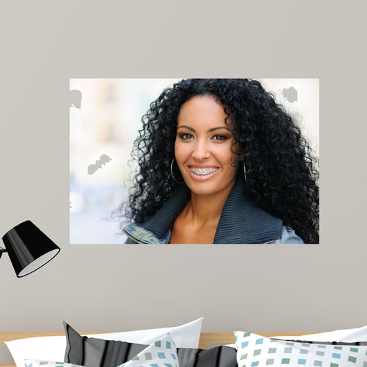 Young black woman smiling with braces 