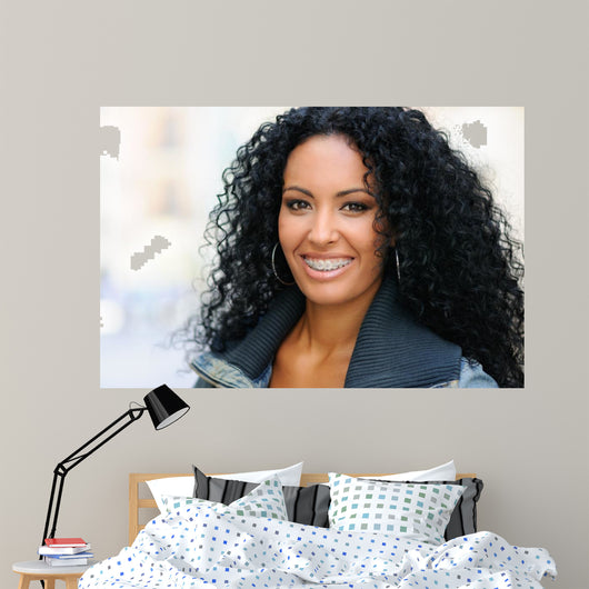 Young black woman smiling with braces 