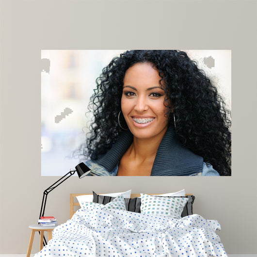 Young black woman smiling with braces 