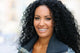 Young black woman smiling with braces 