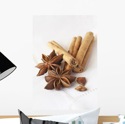 Star anise and cinnamon sticks, on a beige linen napkin. Wall Mural