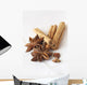 Star anise and cinnamon sticks, on a beige linen napkin. Wall Mural