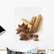 Star anise and cinnamon sticks, on a beige linen napkin. Wall Mural