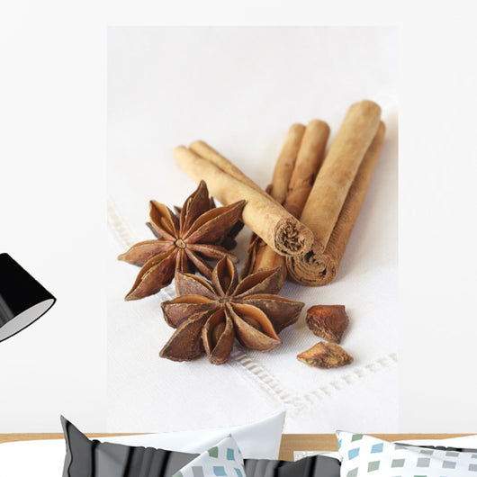 Star anise and cinnamon sticks, on a beige linen napkin. Wall Mural