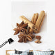 Star anise and cinnamon sticks, on a beige linen napkin. Wall Mural