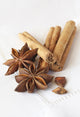 Star anise and cinnamon sticks, on a beige linen napkin. Wall Mural