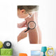Dermatologist examines a mole Wall Mural