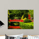 Red Bridge over a Lake in Green Japanese Garden 