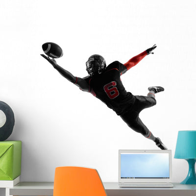 American Football Player Catching shown on a wall