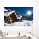 winter ski chalet and cabin in snow mountain  landscape in tyrol 