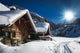 winter ski chalet and cabin in snow mountain  landscape in tyrol 
