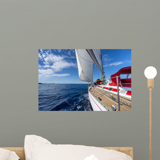 Sailing yacht in blue sea 
