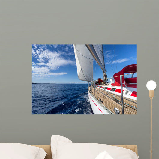 Sailing yacht in blue sea 