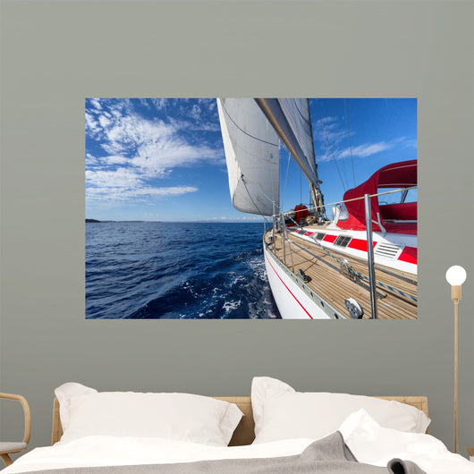 Sailing yacht in blue sea 