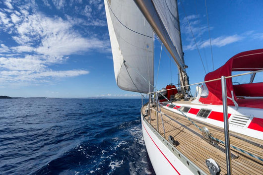 Sailing yacht in blue sea 