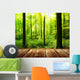 Fresh green forest with sunbeams and wooden floor 