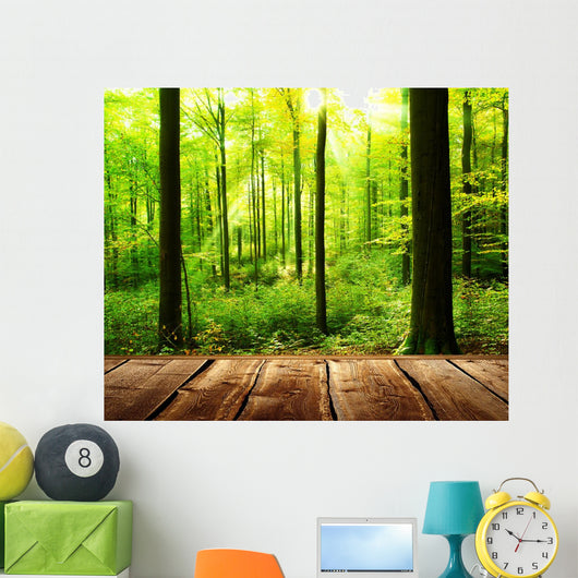 Fresh green forest with sunbeams and wooden floor 