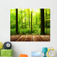 Fresh green forest with sunbeams and wooden floor 