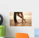 A loving young couple hugging and kissing on the beach. Lovers m Wall Mural