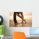 A loving young couple hugging and kissing on the beach. Lovers m Wall Mural