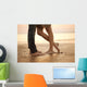 A loving young couple hugging and kissing on the beach. Lovers m Wall Mural