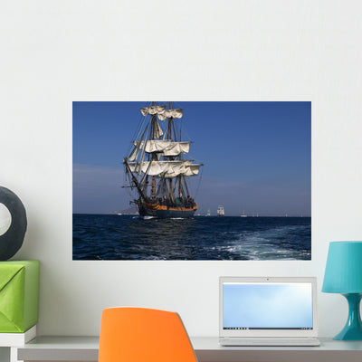 Tall Sailing Ship Sea Wall Mural shown on a wall