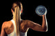 Attractive Young Woman Working Out With Dumbbells 
