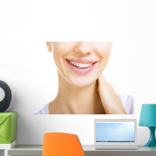 Beautiful smiling girl with retainer for teeth Wall Mural