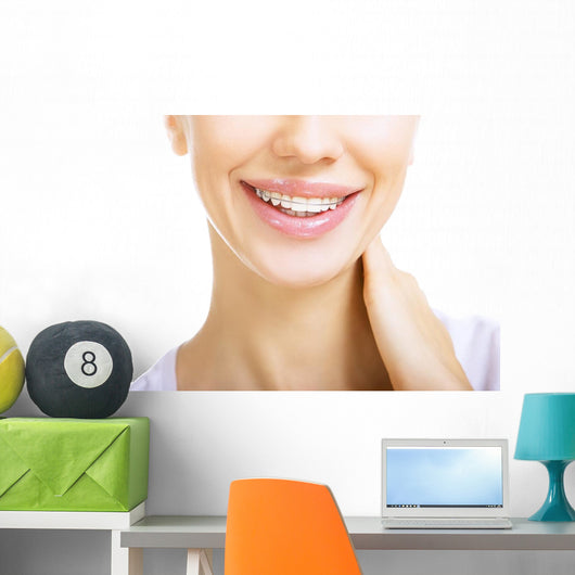 Beautiful smiling girl with retainer for teeth Wall Mural