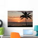 Sunset with single palm Wall Mural