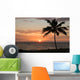 Sunset with single palm Wall Mural