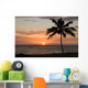 Sunset with single palm Wall Mural