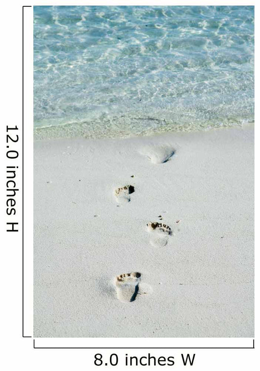 Footprints on a white beach 