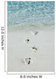 Footprints on a white beach 