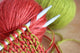 Wool and knitting needles closeup. 
