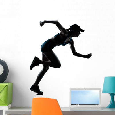 Woman Runner Jogger Silhouette Wall Decal shown on a wall