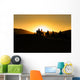 Silhouettes of tourists riding camels on dunes Wall Mural