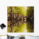 Amsterdam city with green canal in Holland Wall Mural