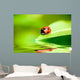 Ladybug Balanced on a Bright Green Leaf Wall Mural