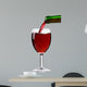 pouring red wine from the bottle into a glass 