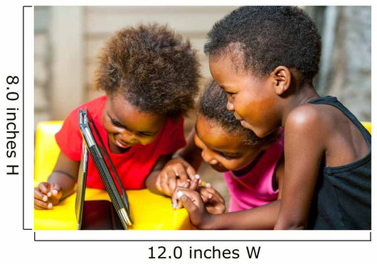 Threesome african kids having fun with tablet. 