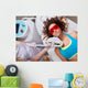 Woman getting laser face treatment in medical spa center 