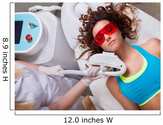Woman getting laser face treatment in medical spa center 