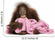 Young Bornean orangutan lying, cuddling a pink towel 