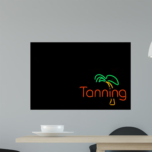 Colorful Neon Sign Advertising a Tanning Booth 