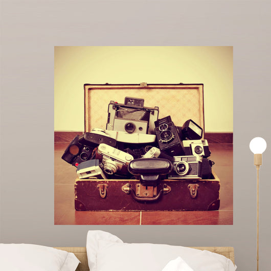 old cameras in an old suitcase 